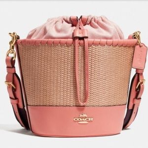 Coach peach color straw bucket bag.